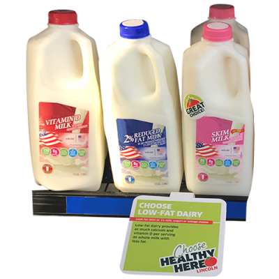 milk with shelf talker displaying which is the healthy choice