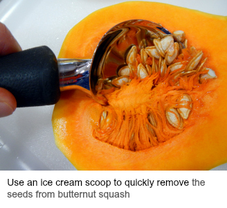 Removing the seeds from a butternut squash with an ice cream scoop