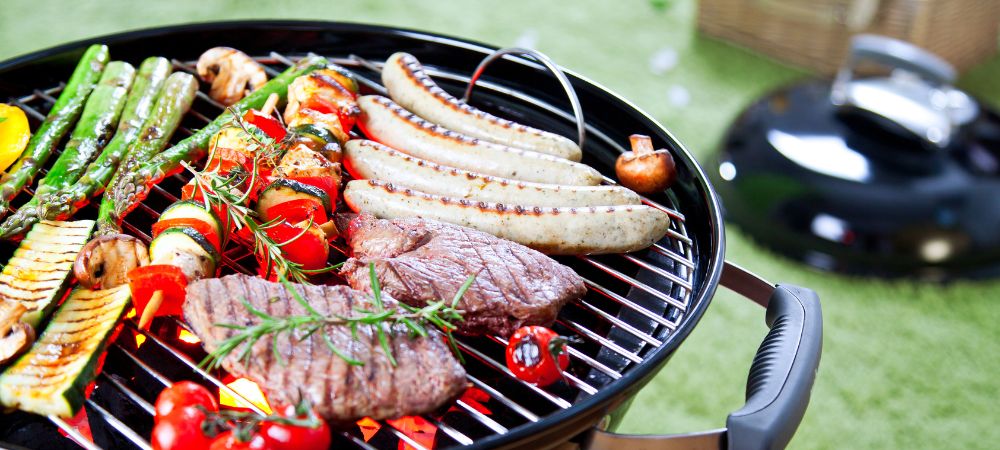 grill cooking meat and vegetables