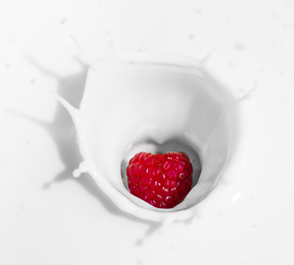 Raspberry dropped in milk