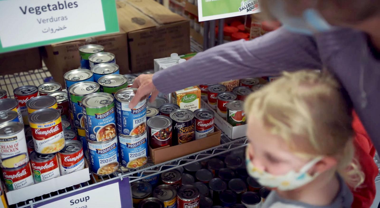 Family choosing healthy food at a food pantry.