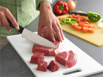 separate foods, cutting meat on plastic cutting board