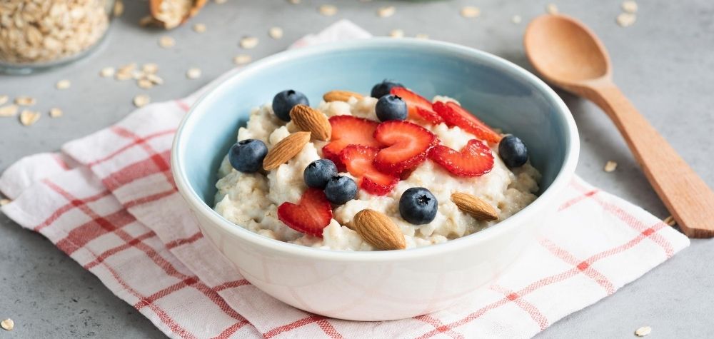 oatmeal in a bowl with strawberries and blueberries