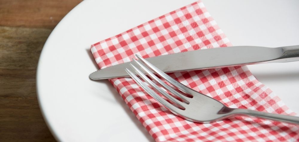 plate with napkin, fork, knife