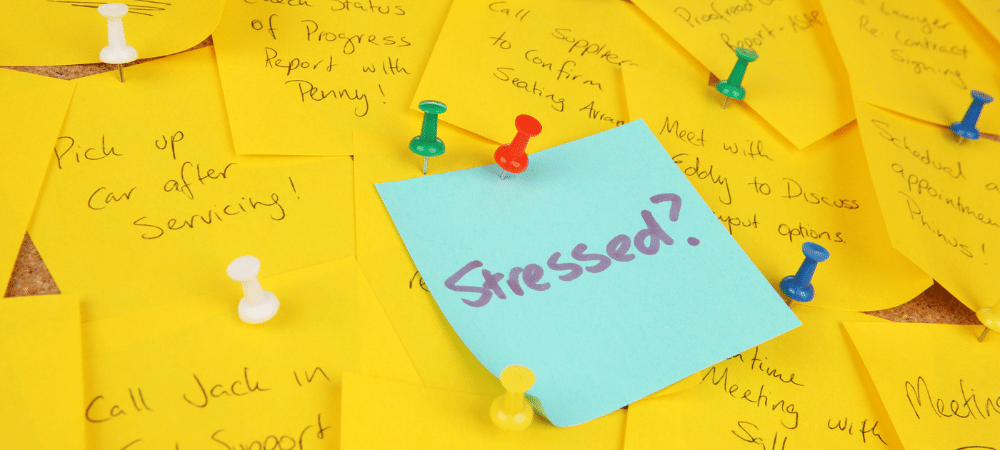 sticky notes with a lot of to-do items that is causing stress