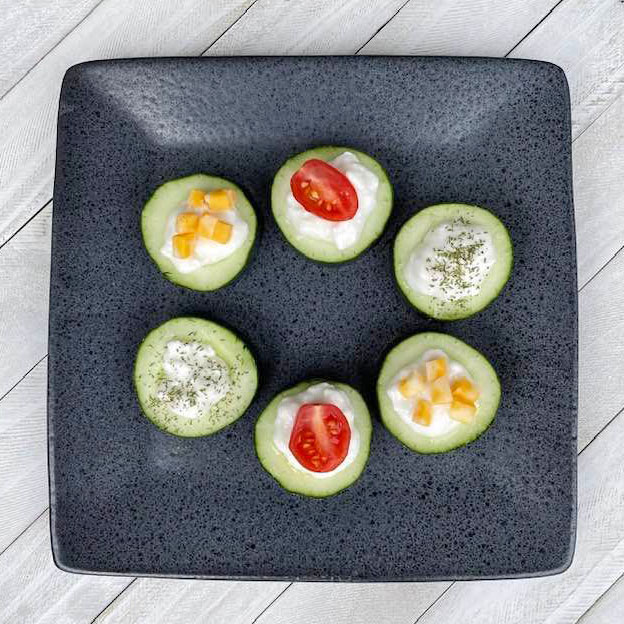 cumcumber bites on a gray plate