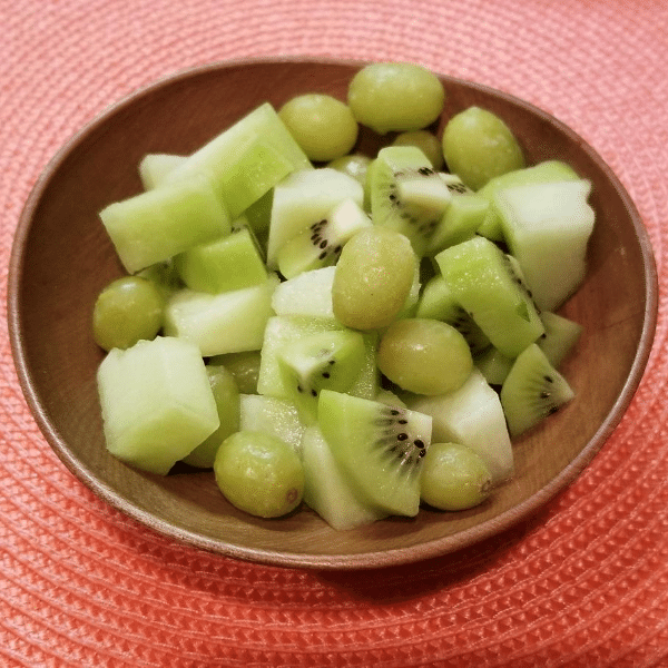 bowl of kiwi, green grapes, and honeydew