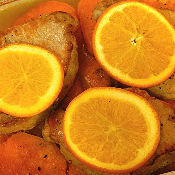 Orange slices, pork and potatoes