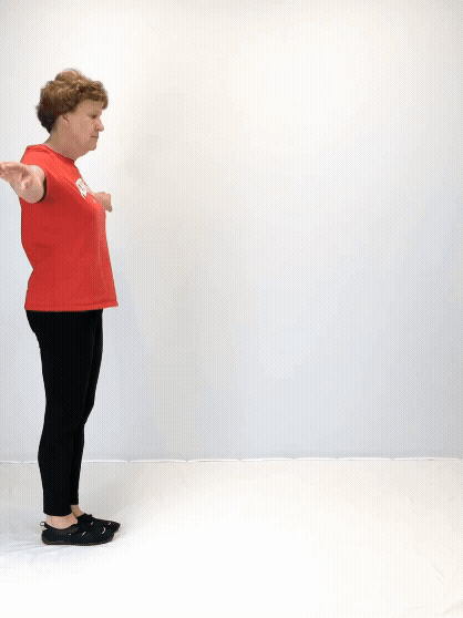 An individual modeling how to do a heel-to-toe balance walk exercise.