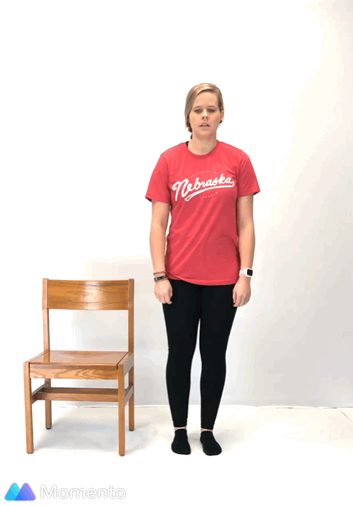An individual modeling how to do a modified triangle yoga pose.