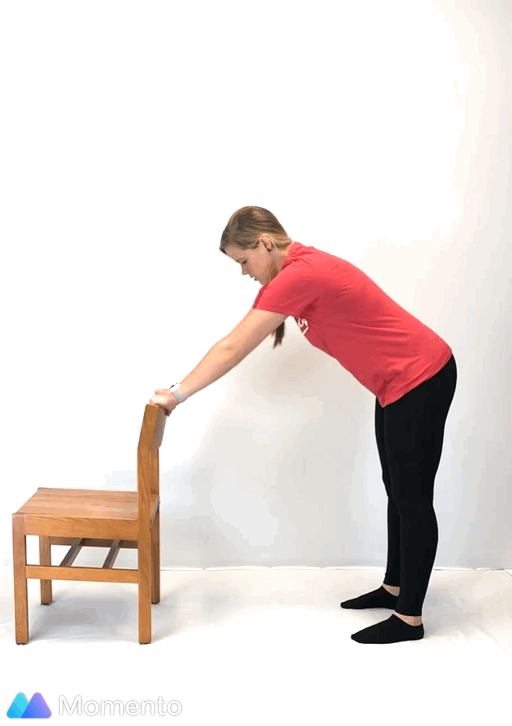 An individual modeling how to do a modified thread the needle yoga pose.