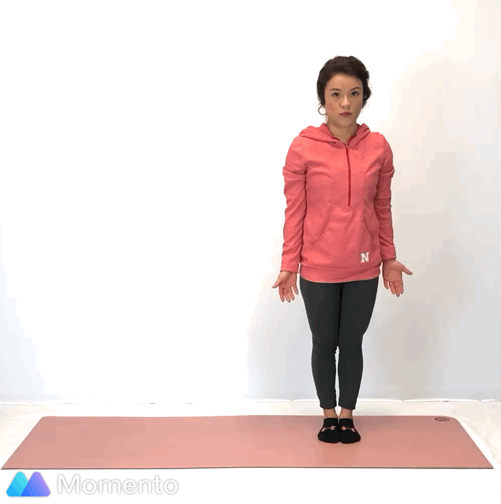 An individual modeling how to do warrior III yoga pose.