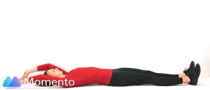 An individual modeling how to do a sprinter sit up exercise.