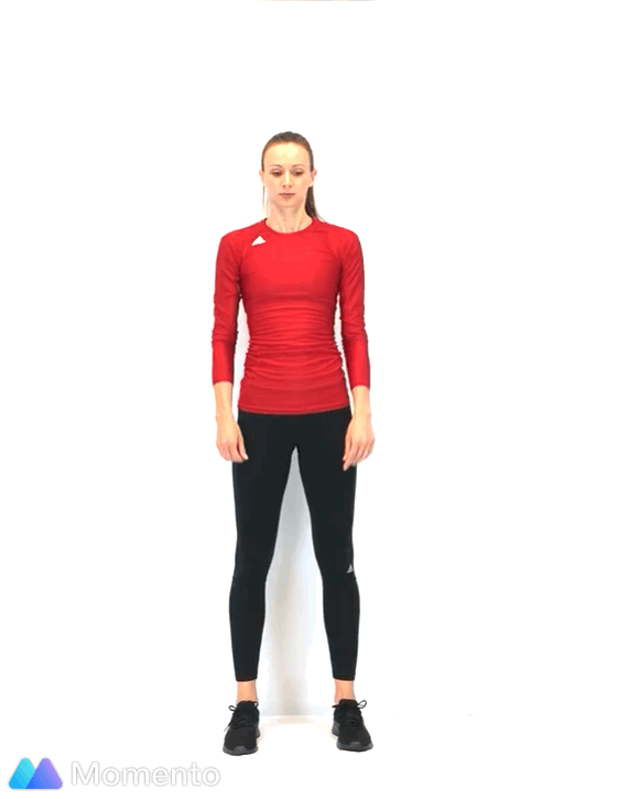 An individual modeling how to do a star jump squat workout.