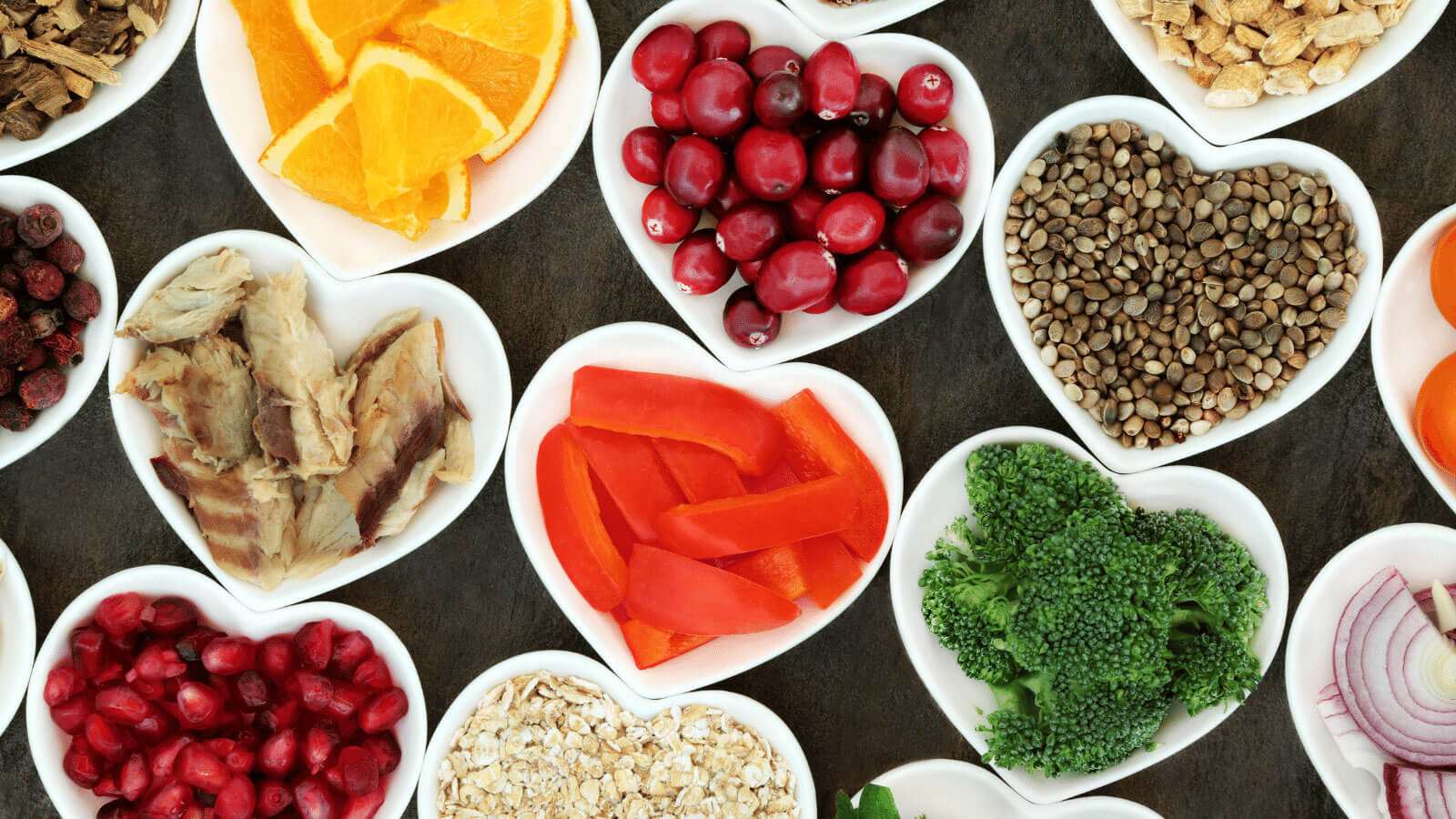 Fruit and vegetables in heart-shaped plates.