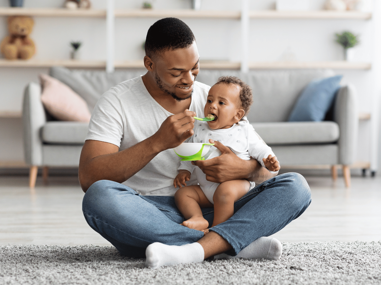 father feeding child