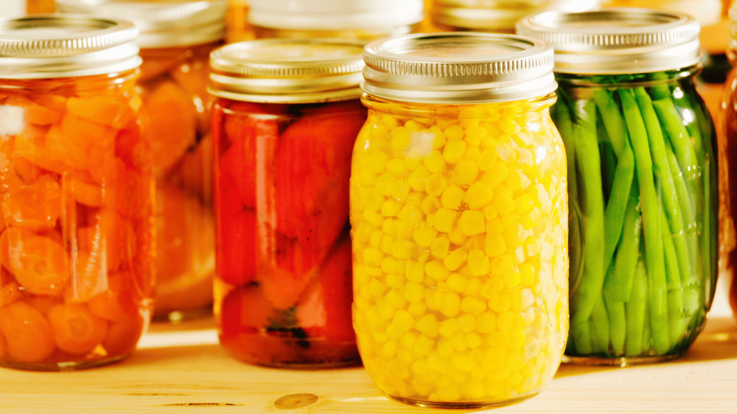 home canned foods such as corn, carrots, green beans, and tomatoes