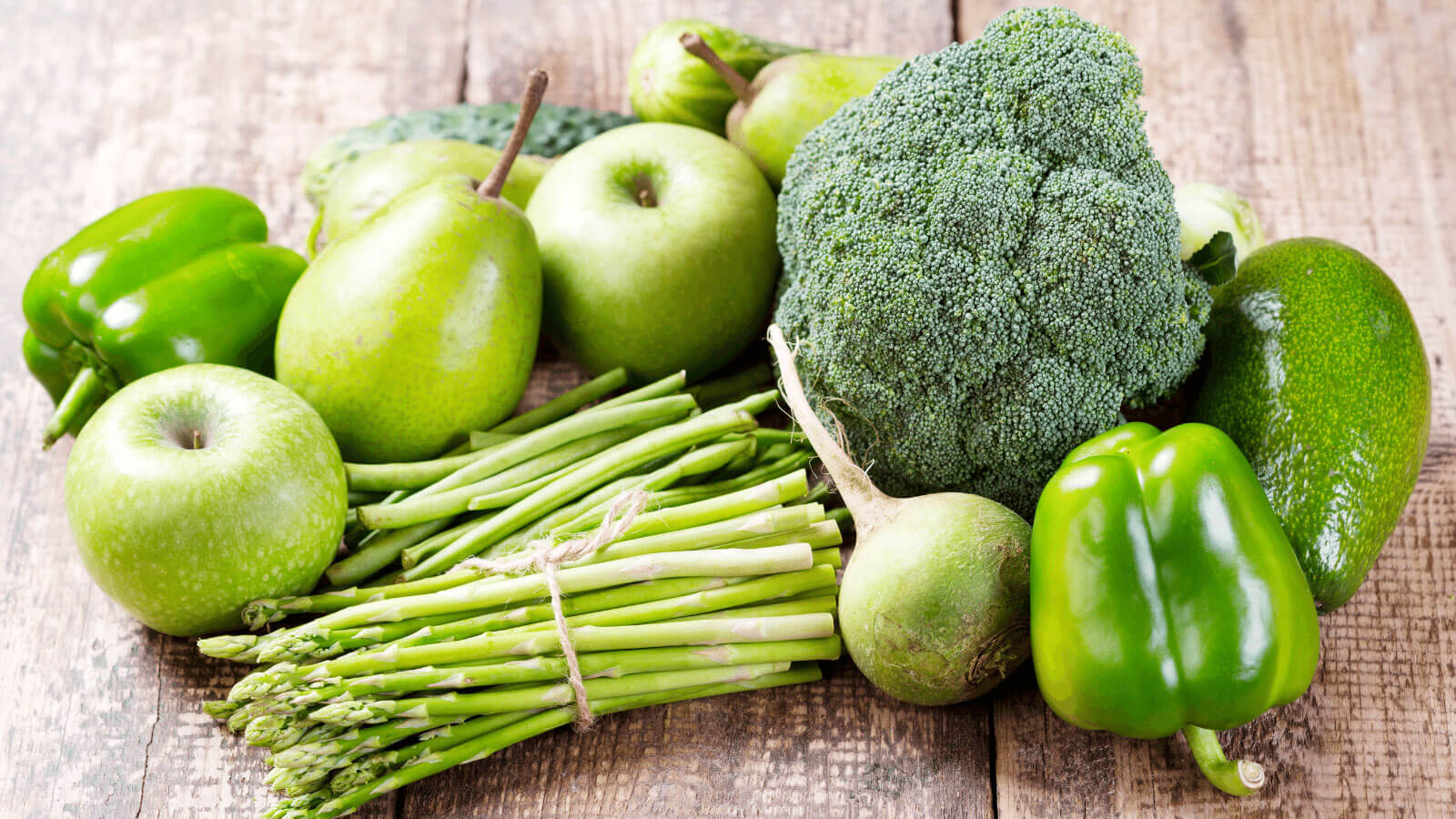 Pile of green fruits and vegetables.