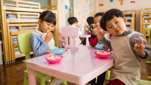 children at a childcare center eating food