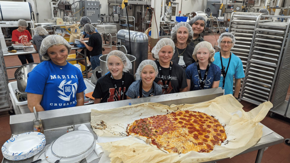 youth exploring science of food with making pizza