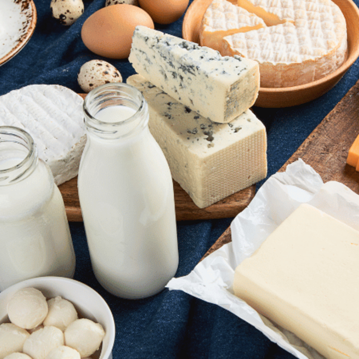 A spread of a variety of dairy products including milk, yogurt, cheese, and more.