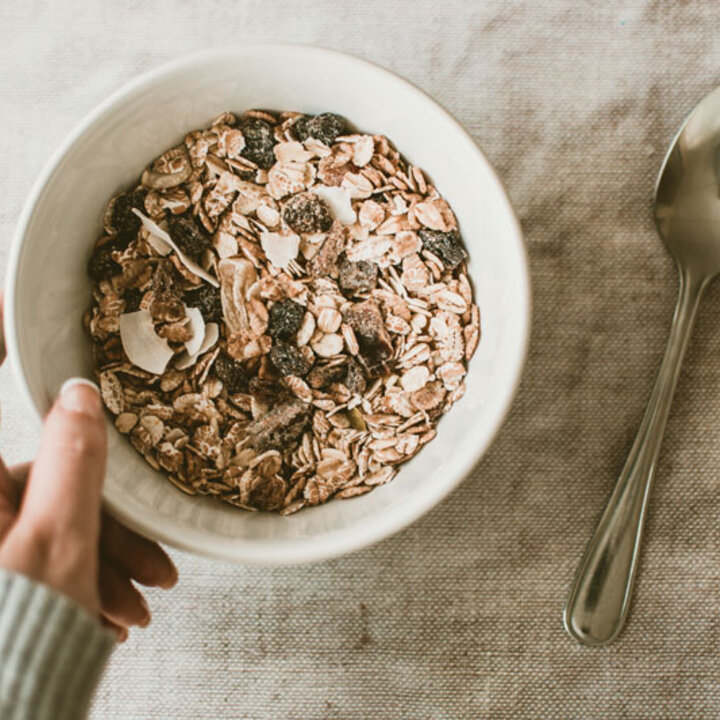 Person holding a bowl full of oats