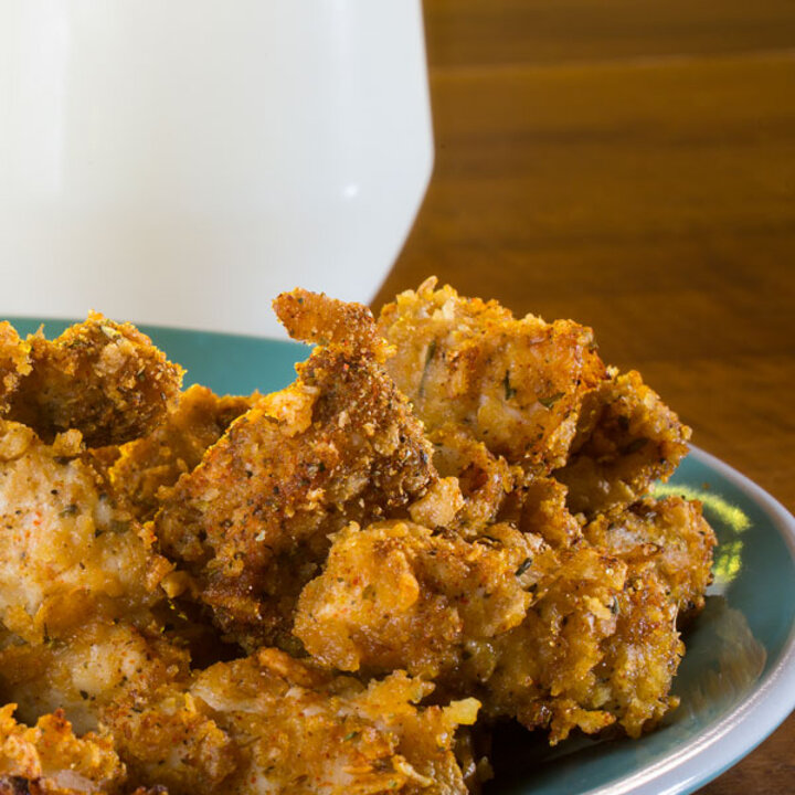 Chicken Nuggets on a plate with milk