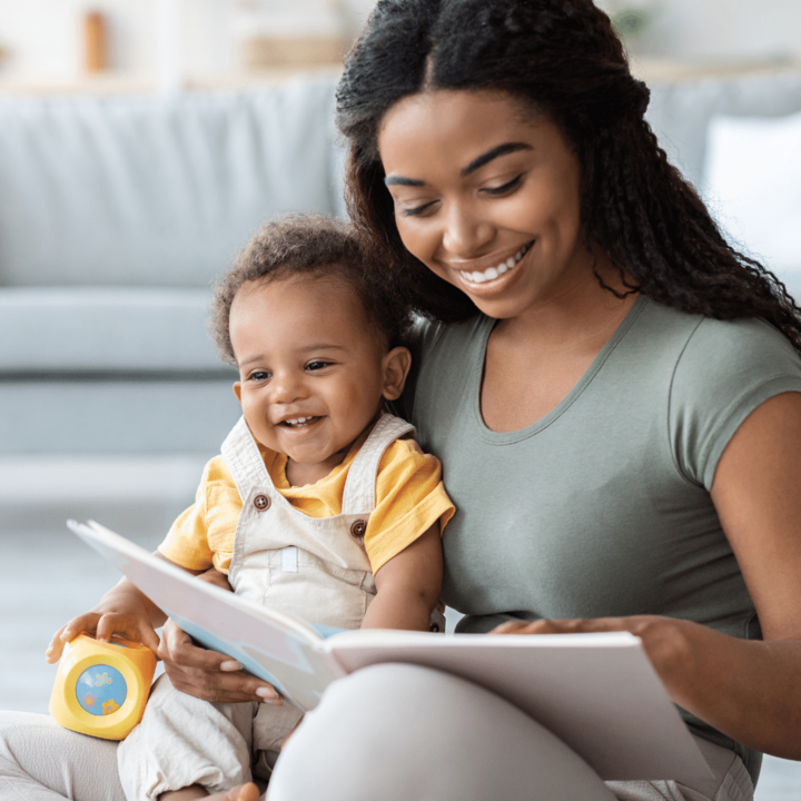 baby with book and toy