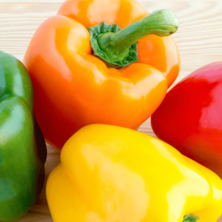 green, orange, red, and yellow bell pepper