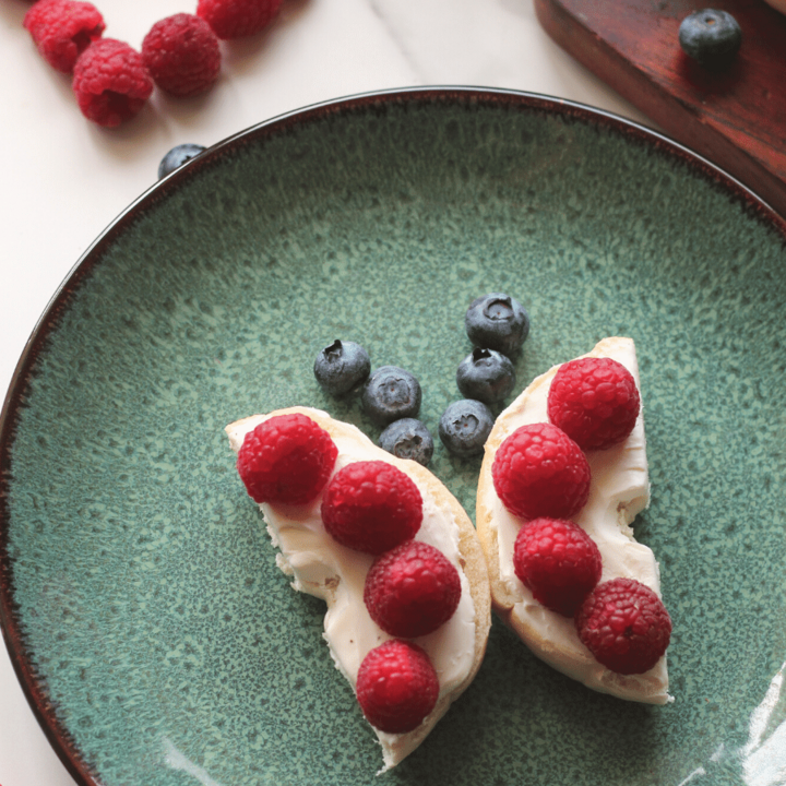 Mini bagel cut in half with berries