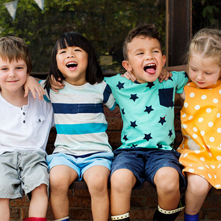 children sitting on a bench