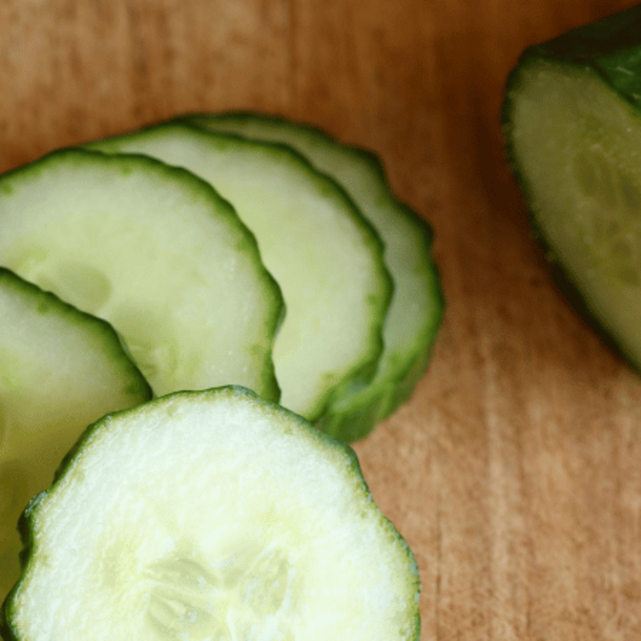 sliced cucumber on cutting board
