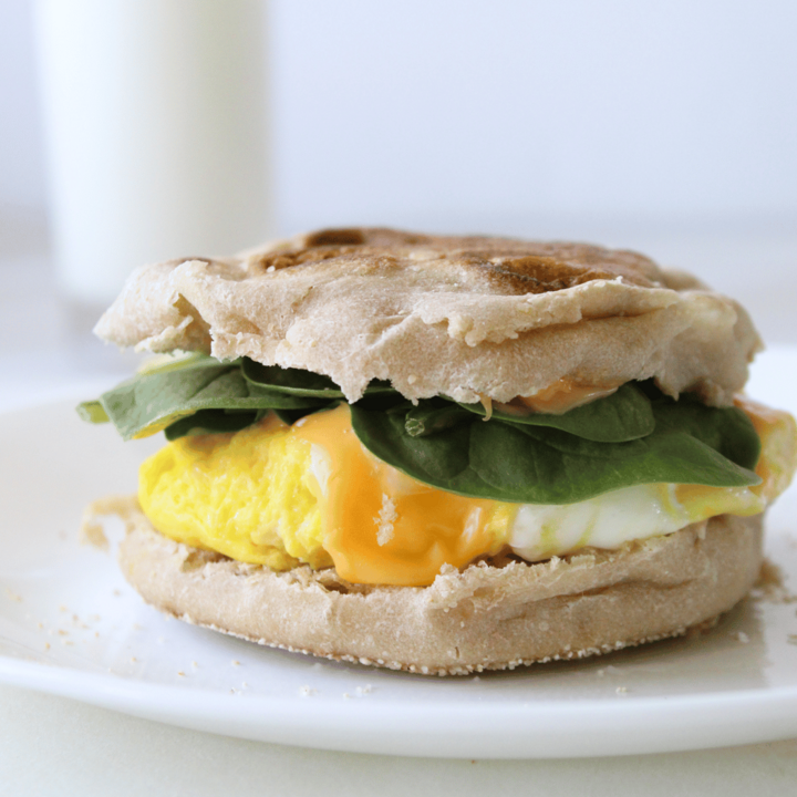 Egg and cheese muffin with a glass of milk