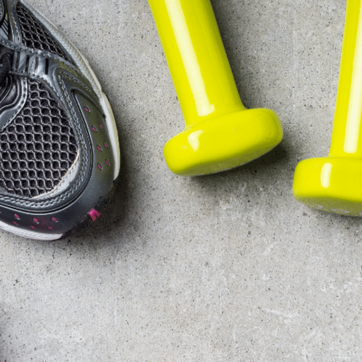 fitness background with tennis shoes, dumbbells, and cell phone