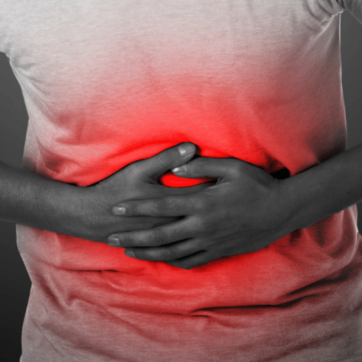 A person is experiencing a stomach ache due to food poisoning.