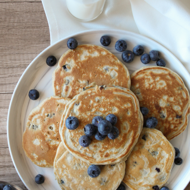 Pancakes on a plate with blueberries