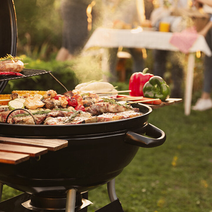 food on a grill at an outdoor party