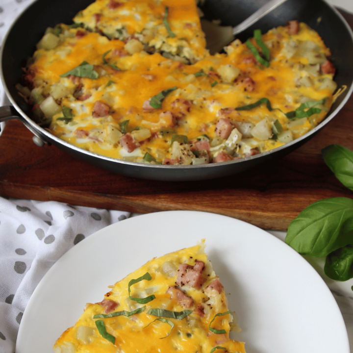 Ham and Egg Frittata in a skillet and on a plate