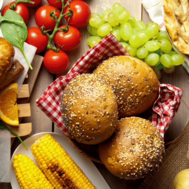 holiday meal with turkey, fresh produce, whole grain bread, and pie