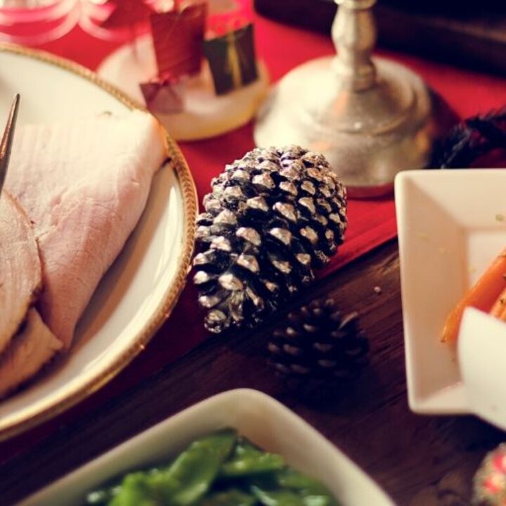 holiday dinner table with ham and carrots