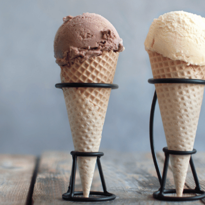 homemade chocolate, vanilla, and strawberry ice cream in ice cream cones