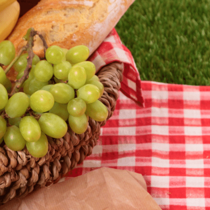 basket of fruit and bread for a summer picnic