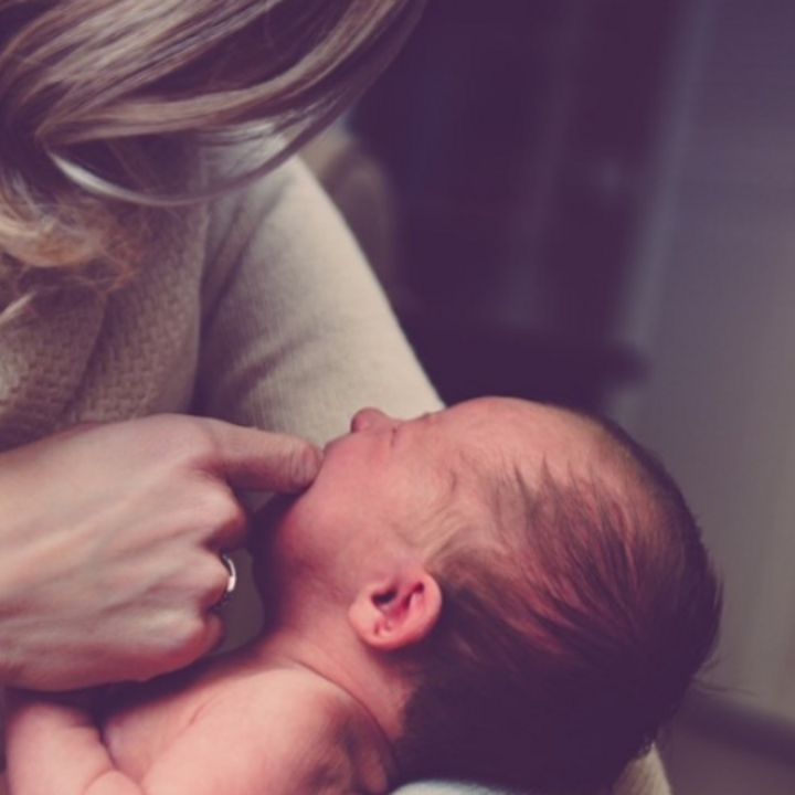 mother holding baby