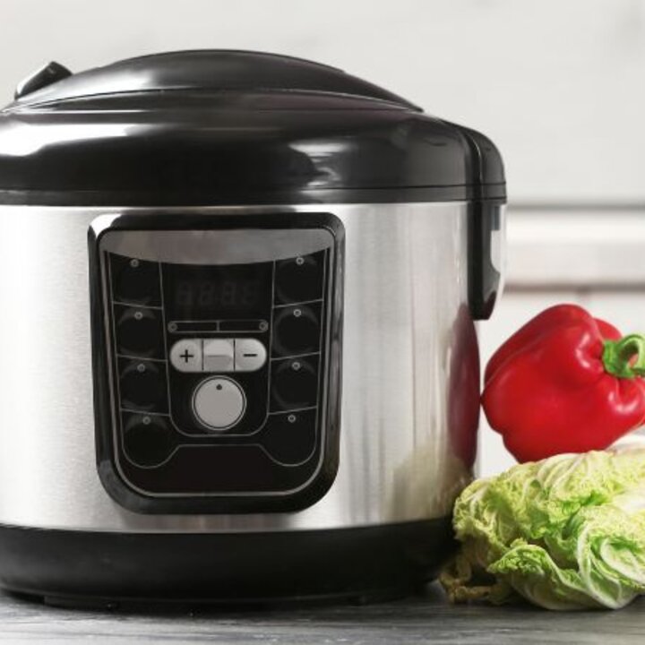 multi-cooker with vegetables, rice, oil