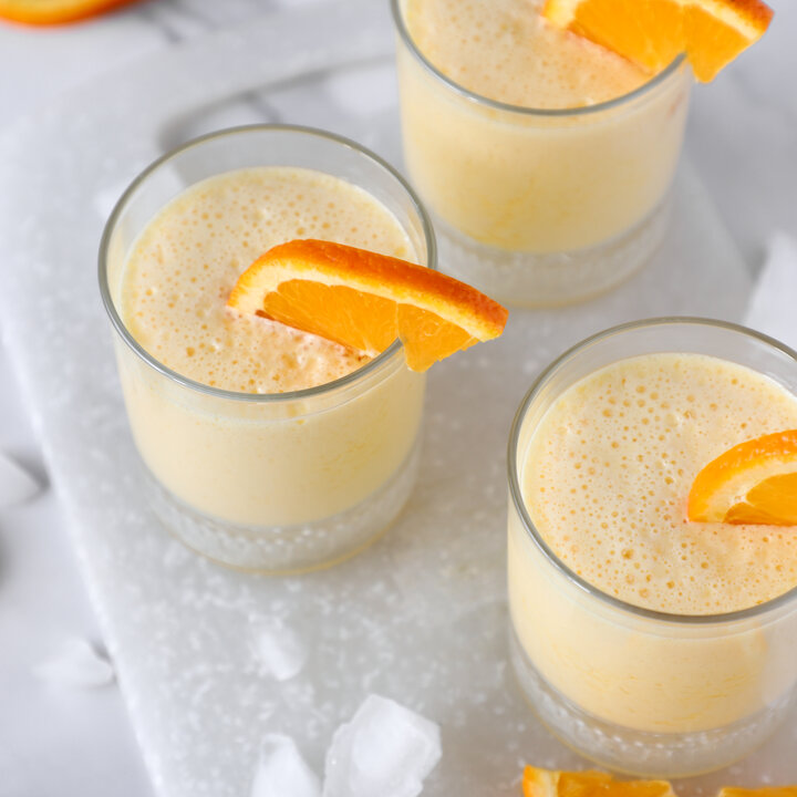 orange slushie in glass cups