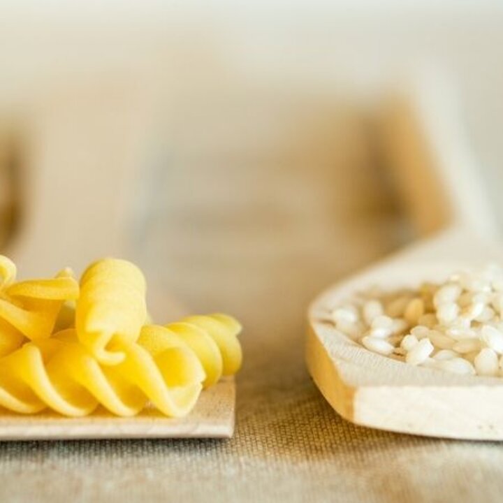 pasta and rice on spoons