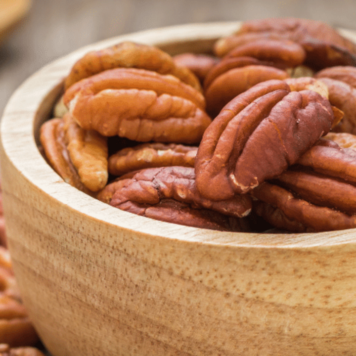 pecans in a bowl on a table