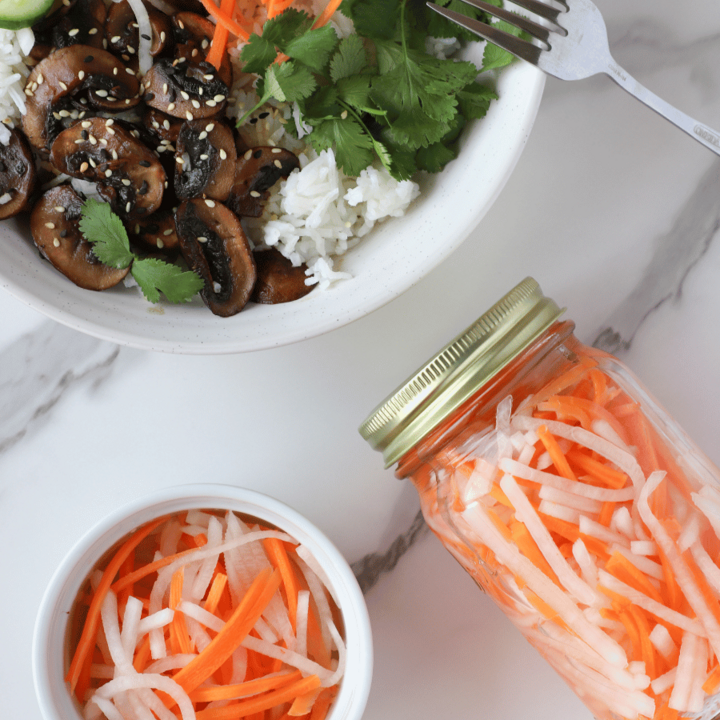 Pickled Daikon and Carrots in a jar and on top of a rice bowl