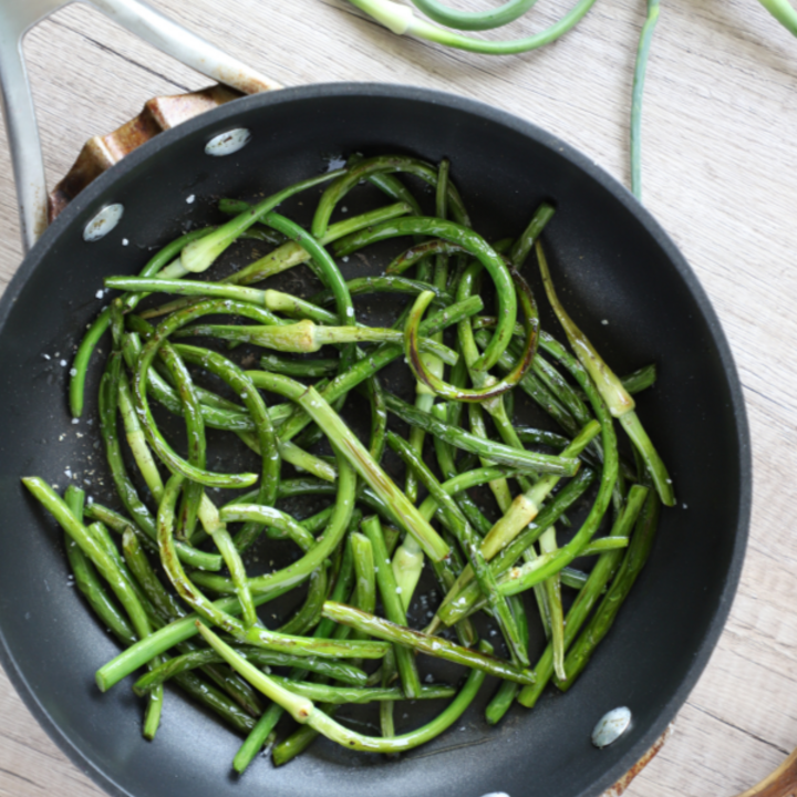 Garlic scapes in a skillet