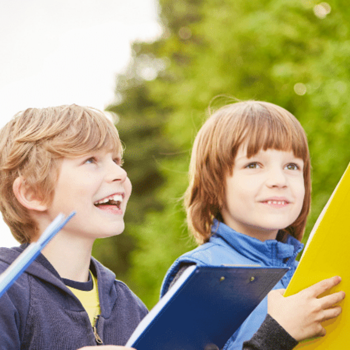 children play scavenger hunt with clipboards